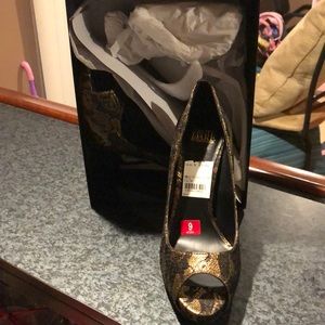 Truth or Dare by Madonna black and gold stilettos